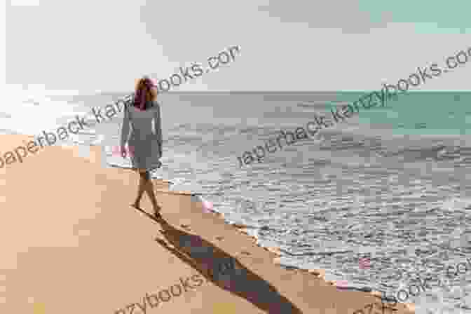 A Woman Walking Along A Beach, Smiling And Enjoying The Sunset. Walking For Weight Loss (The Best Guide On Walking And Weight Loss)