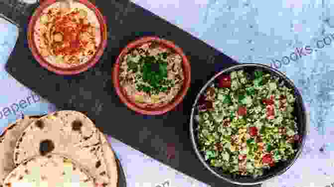 An Assortment Of Colorful Mezze Dishes, Including Hummus, Baba Ghanoush, Falafel, And Tabbouleh. Vegetarian Dishes From The Middle East